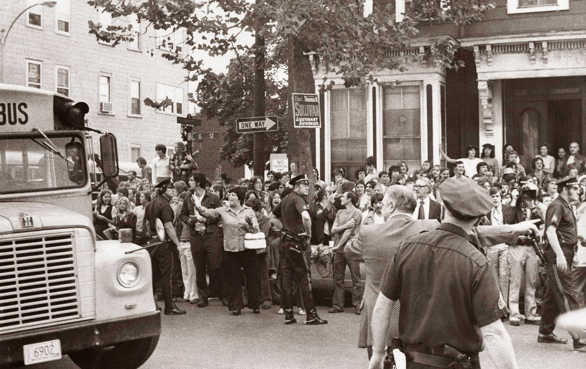 Passing through the gantlet of protesters, a school bus made its way on the first day of school in a South Boston neighborhood on Sept. 12, 1974.