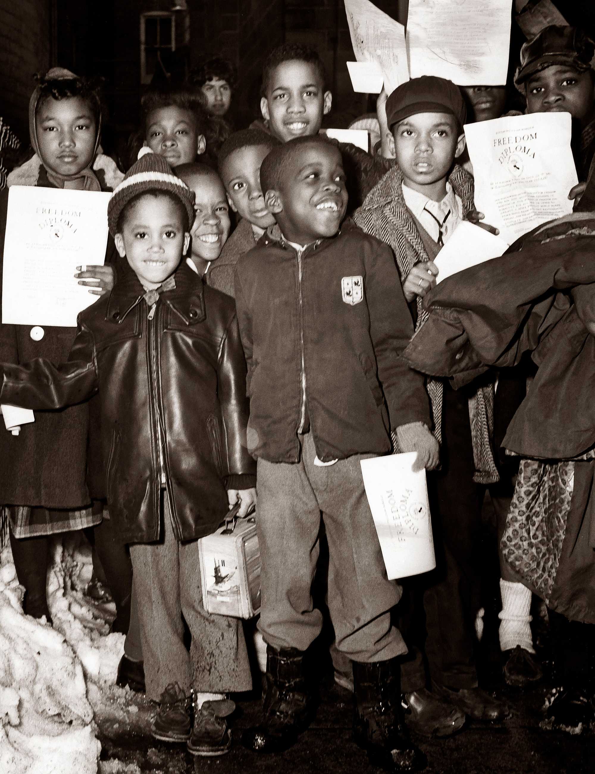Students posed with their diplomas after attending a Freedom School gathering at St. Mark’s Social Center on Feb. 26, 1964. (Louis Russo/Globe Staff)

