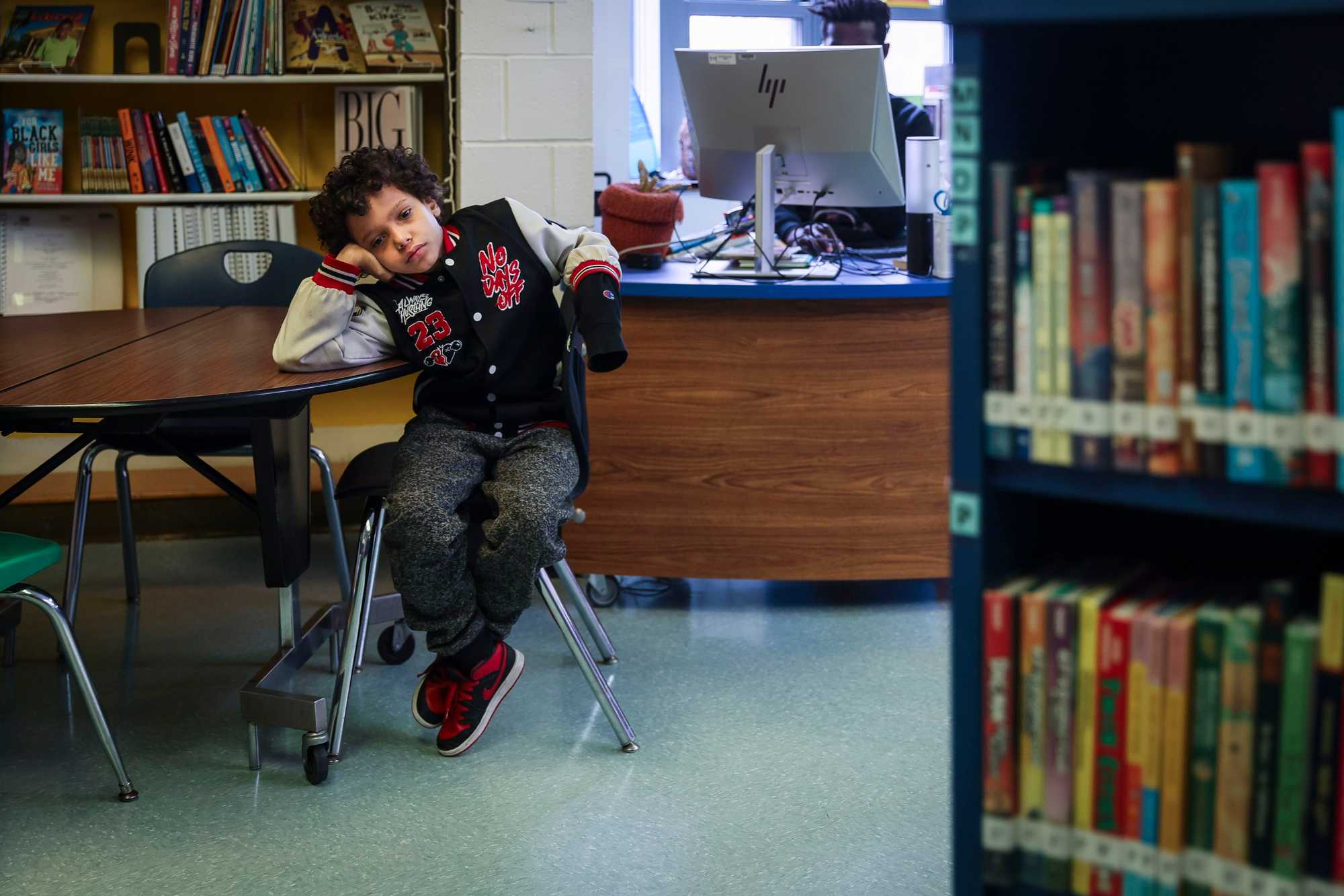 A student at the Lee school rested in the library after taking his Massachusetts Comprehensive Assessment System (MCAS) test. 
