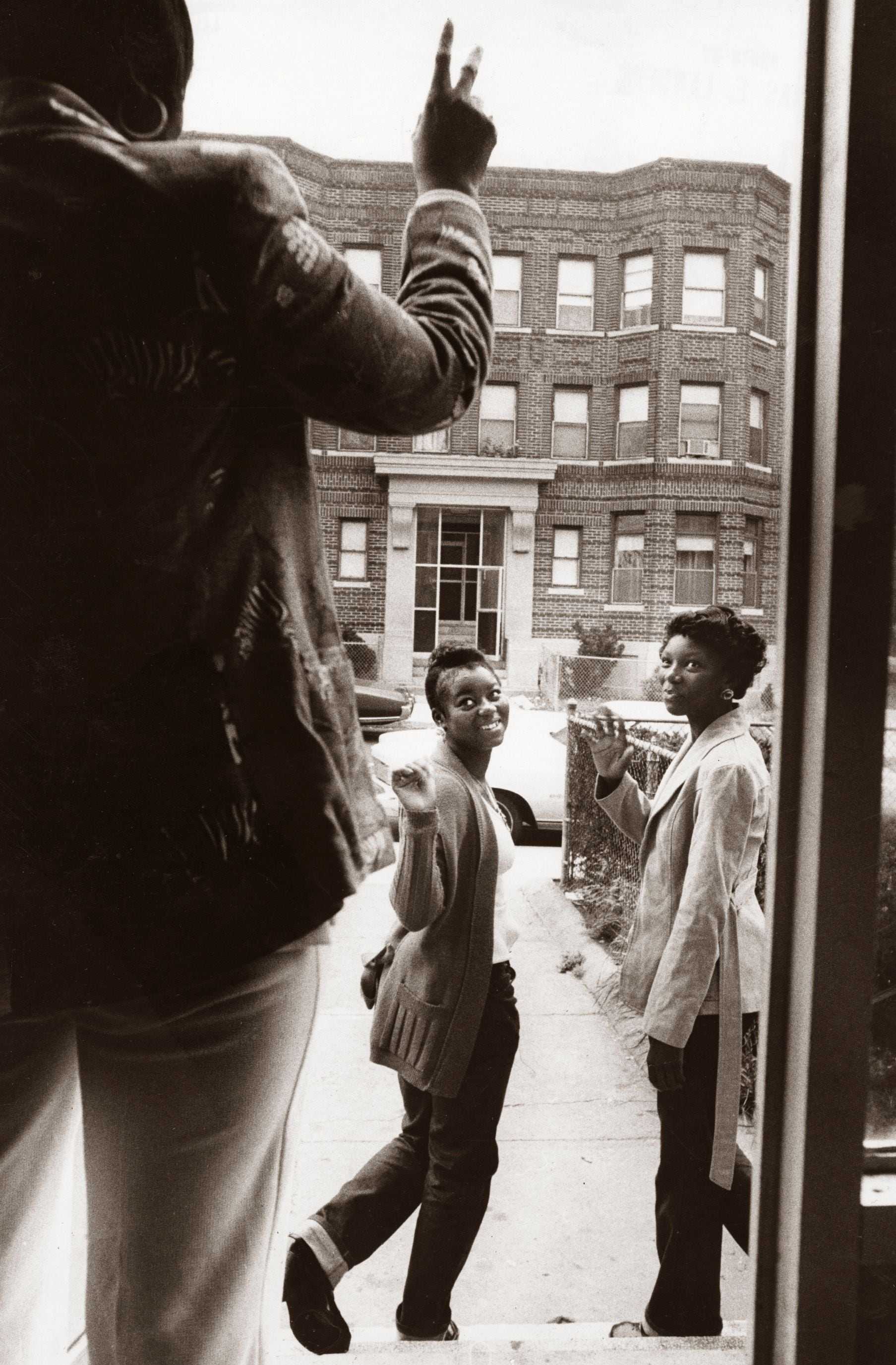 A mother's first day of school send-off for her daughters headed to high school in Roxbury on Sept. 12, 1974.