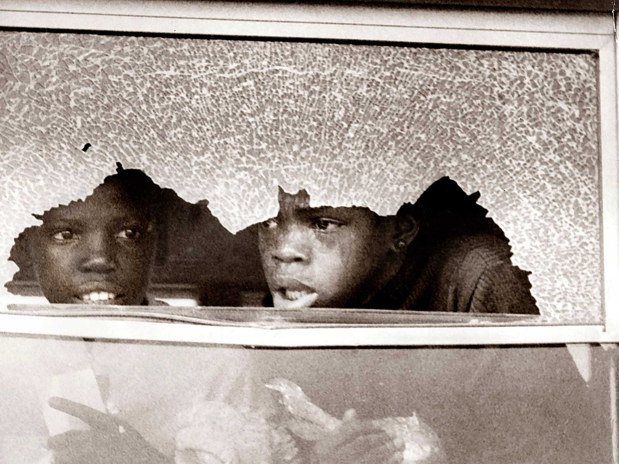 Two Boston students on a bus that was attacked as it returned to Columbia Point Sept. 12, 1974.