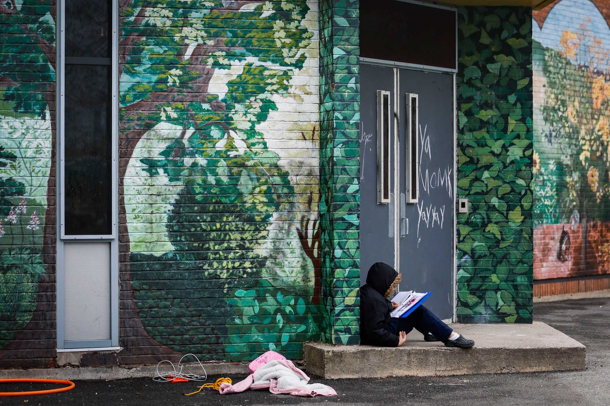 A student at the Lee worked on a homework assignment during a recent recess.