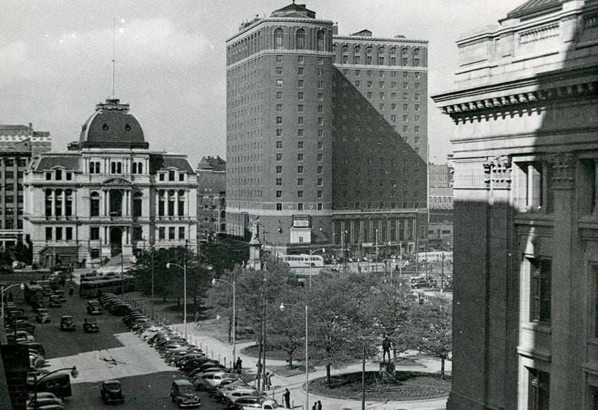 The Biltmore Hotel and neighboring buildings, seen from across a plaza in Providence. 