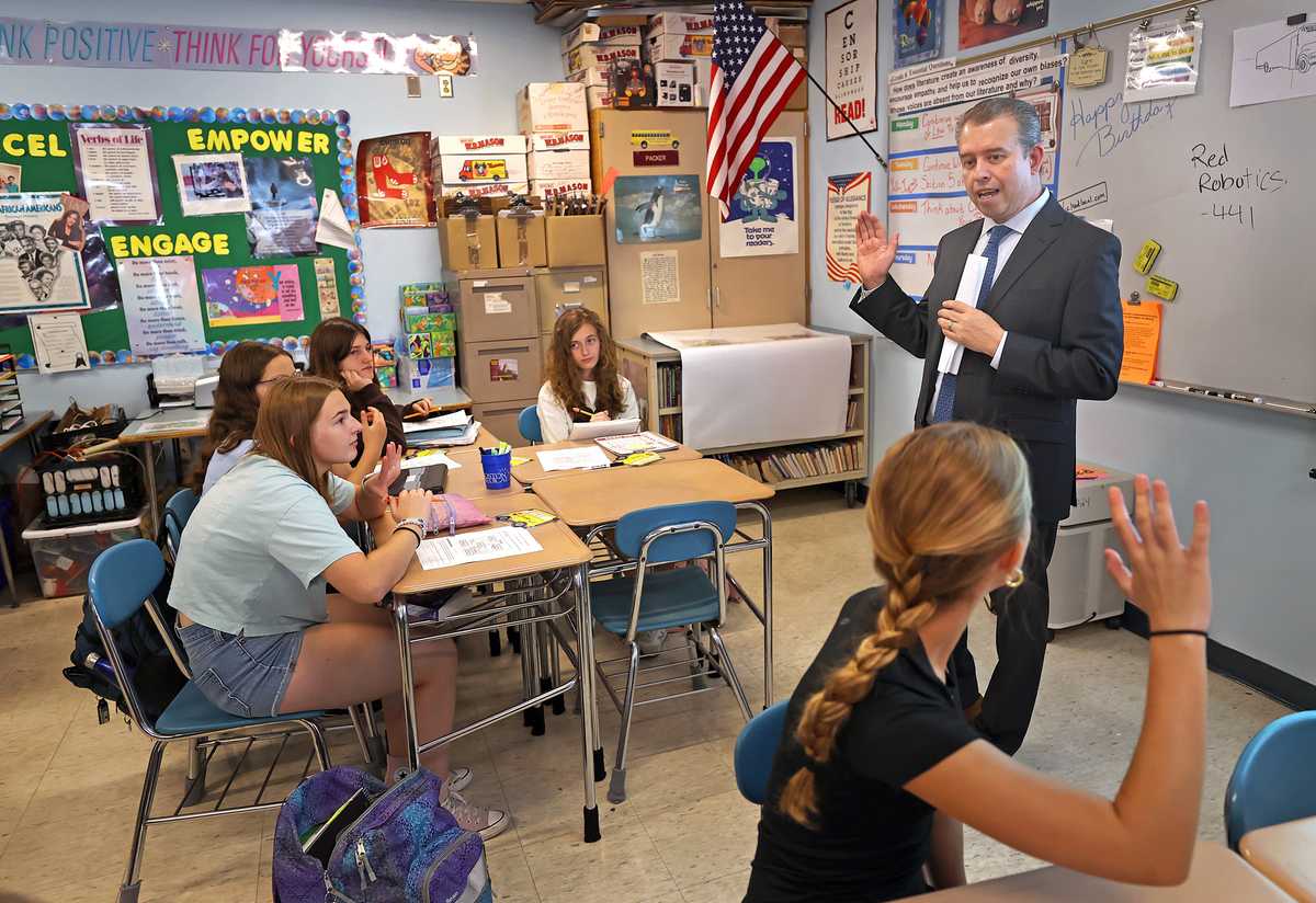 On a tour of the Ottoson Middle School in Arlington, Education Commissioner Pedro Martinez visited eighth-grade teacher Judy Packer’s classroom and took questions from students. Arlington was the largest Massachusetts district to report full recovery in grades 3 to 8 in both math and English.