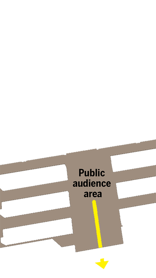 Benches for audience area where the officer sat and the exit door to the bottom
