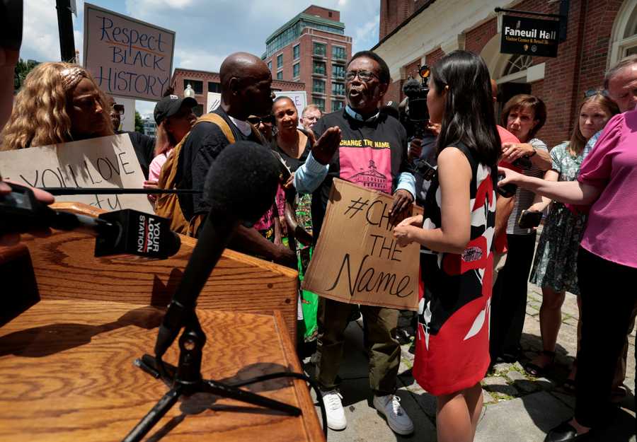 (For Brian MacQuarrie story on Peter Faneuil) 
Boston, MA - 6/16/2023: Edwin Sumpter, center,  of the New Democracy Coalition talks with Boston Mayor Michelle Wu during an opening ceremony for city’s new “Slavery in Boston” exhibit at Faneuil Hall in Boston, MA on June 16, 2023. Sumpter supports a name change for the historic landmark. (Craig F. Walker/Globe Staff)  