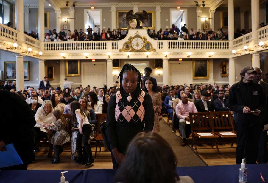 (For Brian Macquarrie story on  Peter Faneuil) Boston,MA - 2/16/2023: Elisabeth (cq) Eugene registers as she arrives at a Naturalization Ceremony in the Great Hall of Faneuil Hall in Boston, MA on February 16, 2023. Eugene came to the states 5 years ago.  (Craig F. Walker/Globe Staff) Peter Faneuil