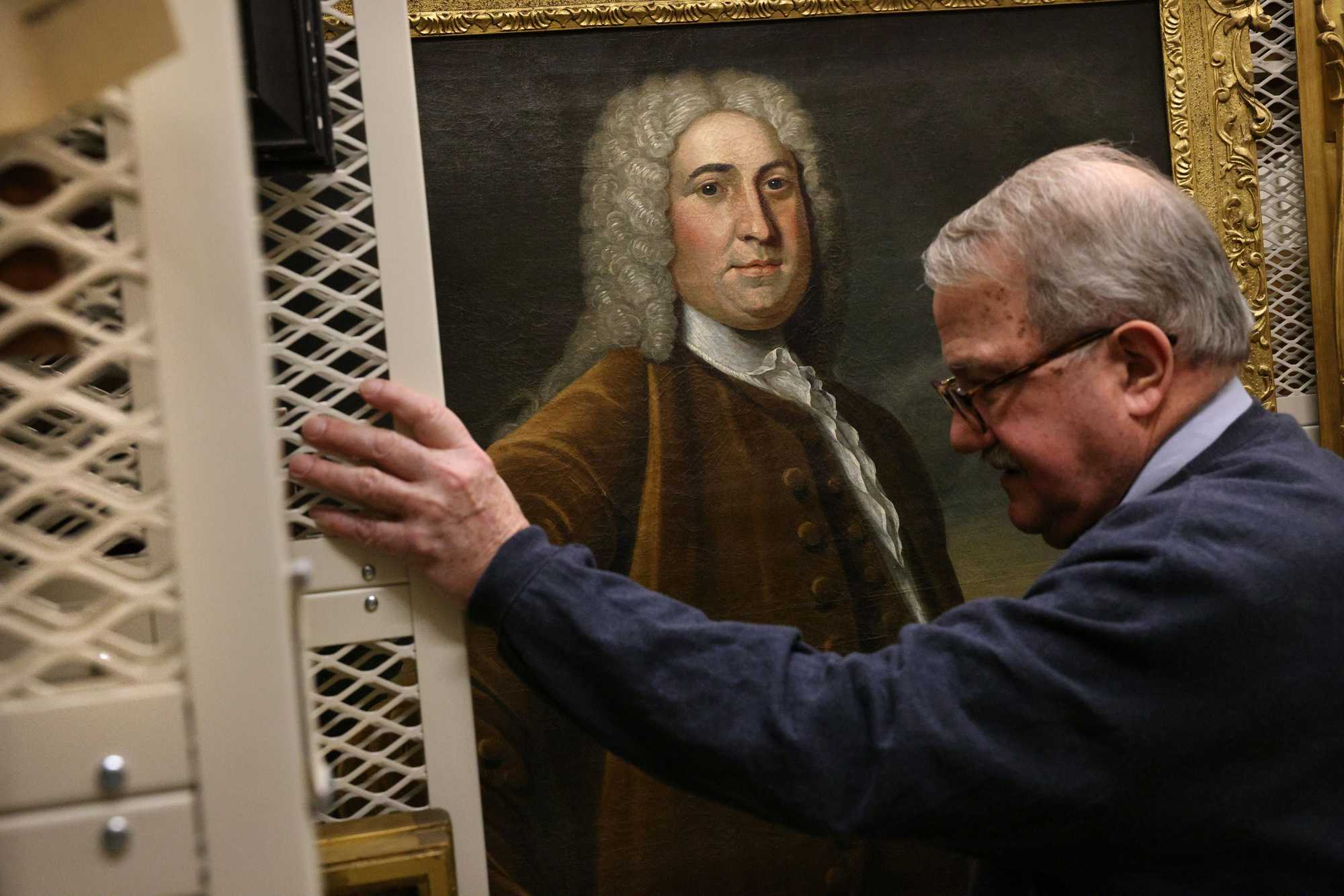 A portrait of Peter Faneuil painted by John Smibert was displayed by chief historian and librarian Peter Drummey in the stacks at the Massachusetts Historical Society in Boston.
