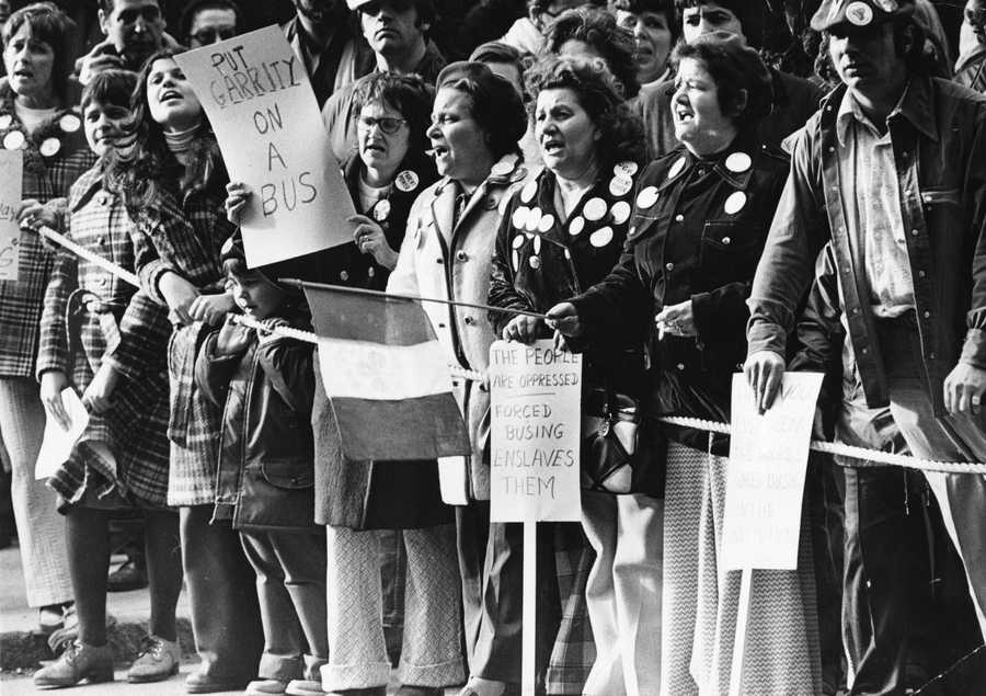 People against busing protested outside the Massachusetts Bar Association office in Boston while Judge W. Arthur Garrity Jr. received an award inside on Mar. 13, 1975. (Tom Landers/Globe Staff) 