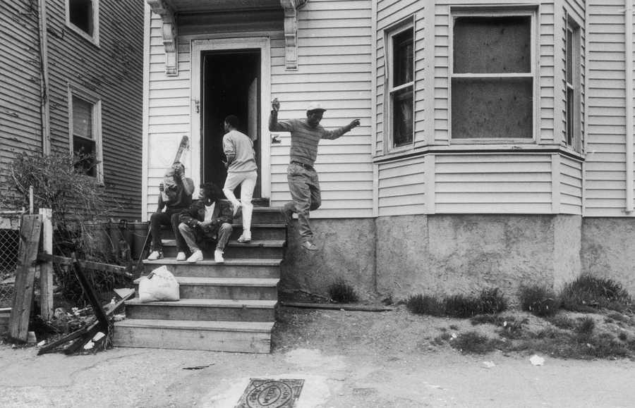  People outside a house known to sell crack cocaine, located in Roxbury, in 1990. (Milbert Orlando Brown)                   