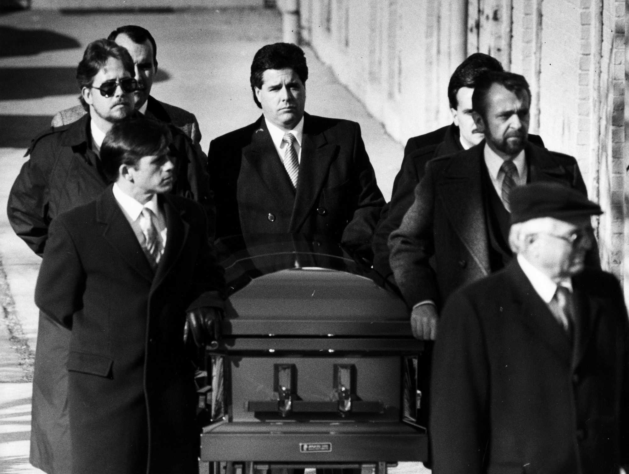 The casket carrying Charles Stuart's body was rolled away at Immaculate Conception Church in Revere on Jan. 7, 1990. 