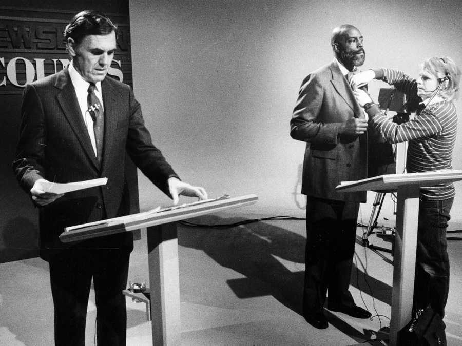 Boston, MA - 10/26/1983: Boston mayoral candidate Mel King, right, has a microphone attached by technicians as candidate Ray Flynn reviews notes minutes before the start of a televised debate in Boston on Oct. 26, 1983.  (John Tlumacki/Globe Staff) --- BGPA Reference: 170407_BS_014