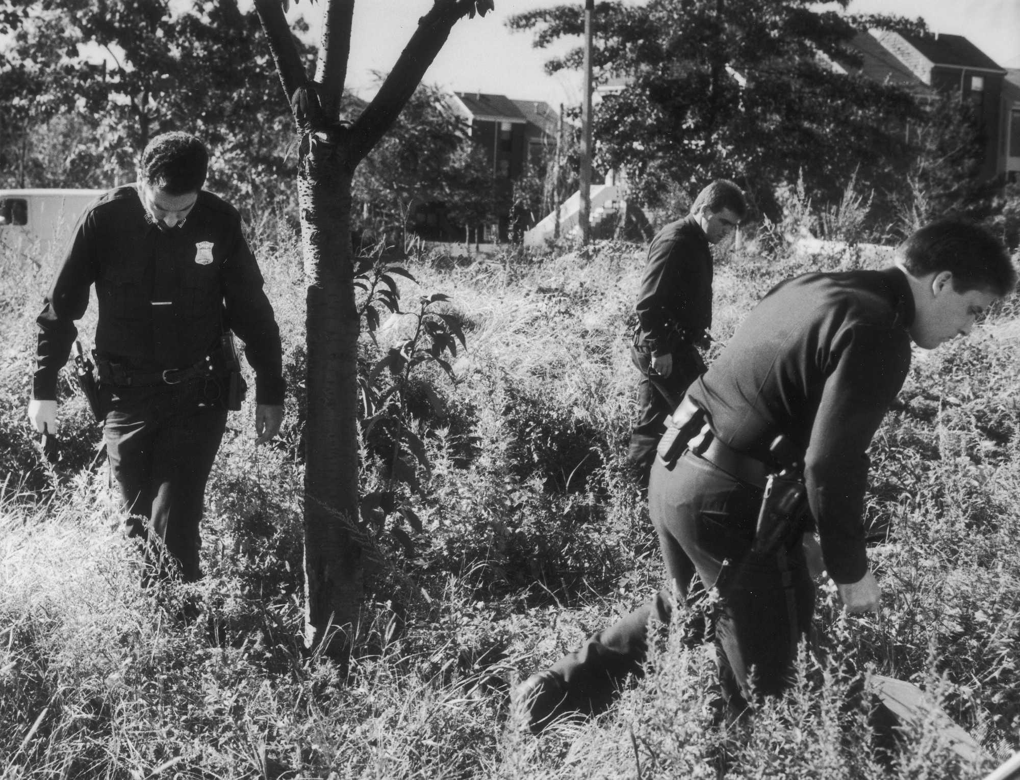 Boston police officers searched a lot along Shawmut Avenue near Melnea Cass Boulevard after they received a tip that two men were seen with a handgun on Oct. 24, 1989. Police said the gun they found was not the same caliber as the one used in the Carol Stuart shooting.
