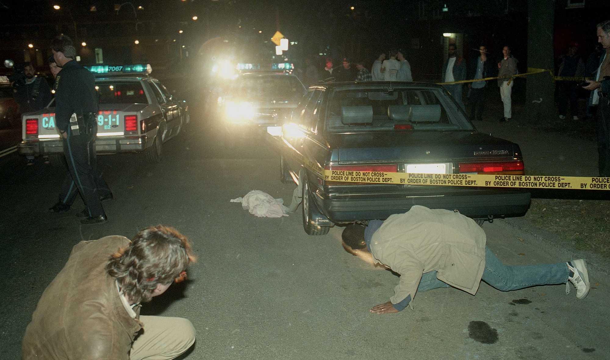 Police examined the scene of the shooting and the Stuarts' car on St. Alphonsus Street in Mission Hill on Oct. 23, 1989.