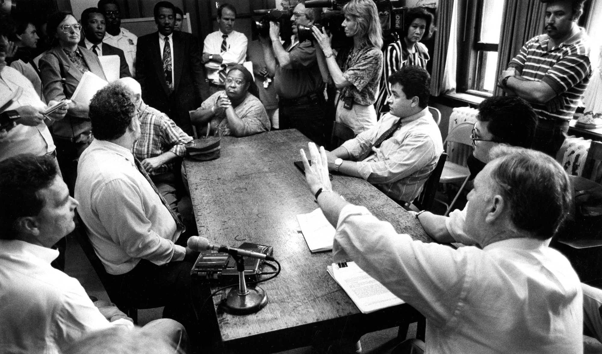 Boston Mayor Ray Flynn (right) met with tenants of the Mission Hill neighborhood to explain a report released by the Boston police's office of internal investigation concerning the handling of the Carol DiMaiti murder investigation on Aug. 19, 1992. The report cleared all but one police detective of misconduct in the investigation.