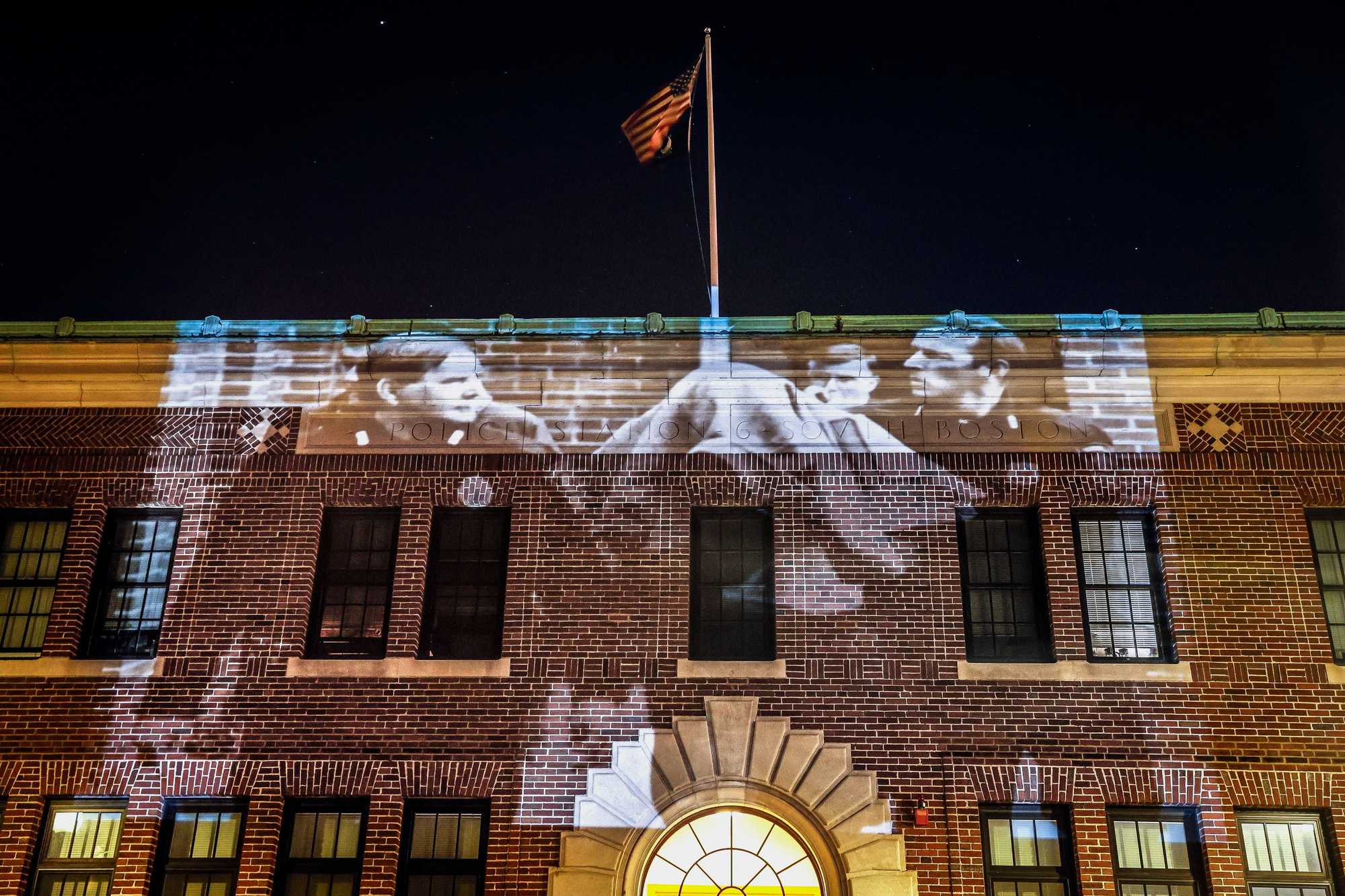 A photo of William "Willie" Bennett after his arraignment at Brookline District Court on Nov. 13, 1989, is projected on the former Boston Police Department’s homicide unit in South Boston, where teenagers testified against Bennett. Bennett was arraigned on charges he robbed a Brookline video store at gunpoint on Oct. 2, 1989, but was publicly reported to be the main suspect in the shootings of Carol and Charles Stuart.

