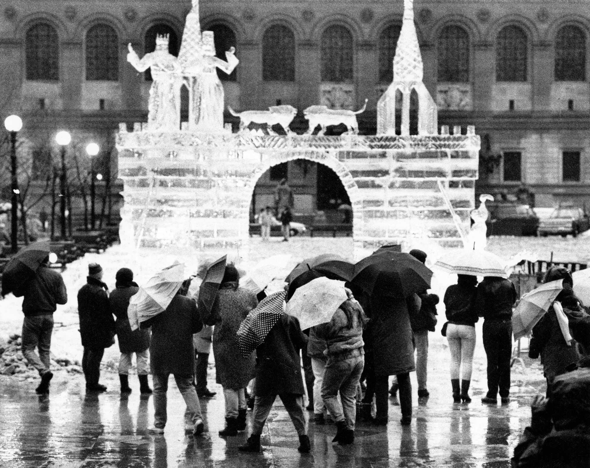 Rain-soaked attendees admired an ice sculpture at Copley Square during First Night festivities in Boston on Dec. 31, 1989. 