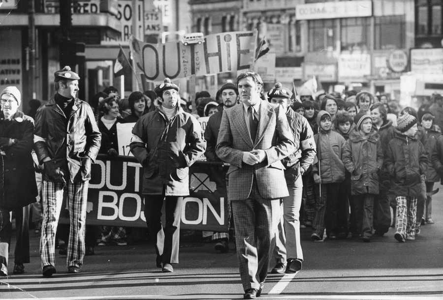 Then-State Rep. Ray Flynn took part in an antibusing march in a Southie neighborhood on Dec. 15, 1974. (David L. Ryan/Globe Staff)