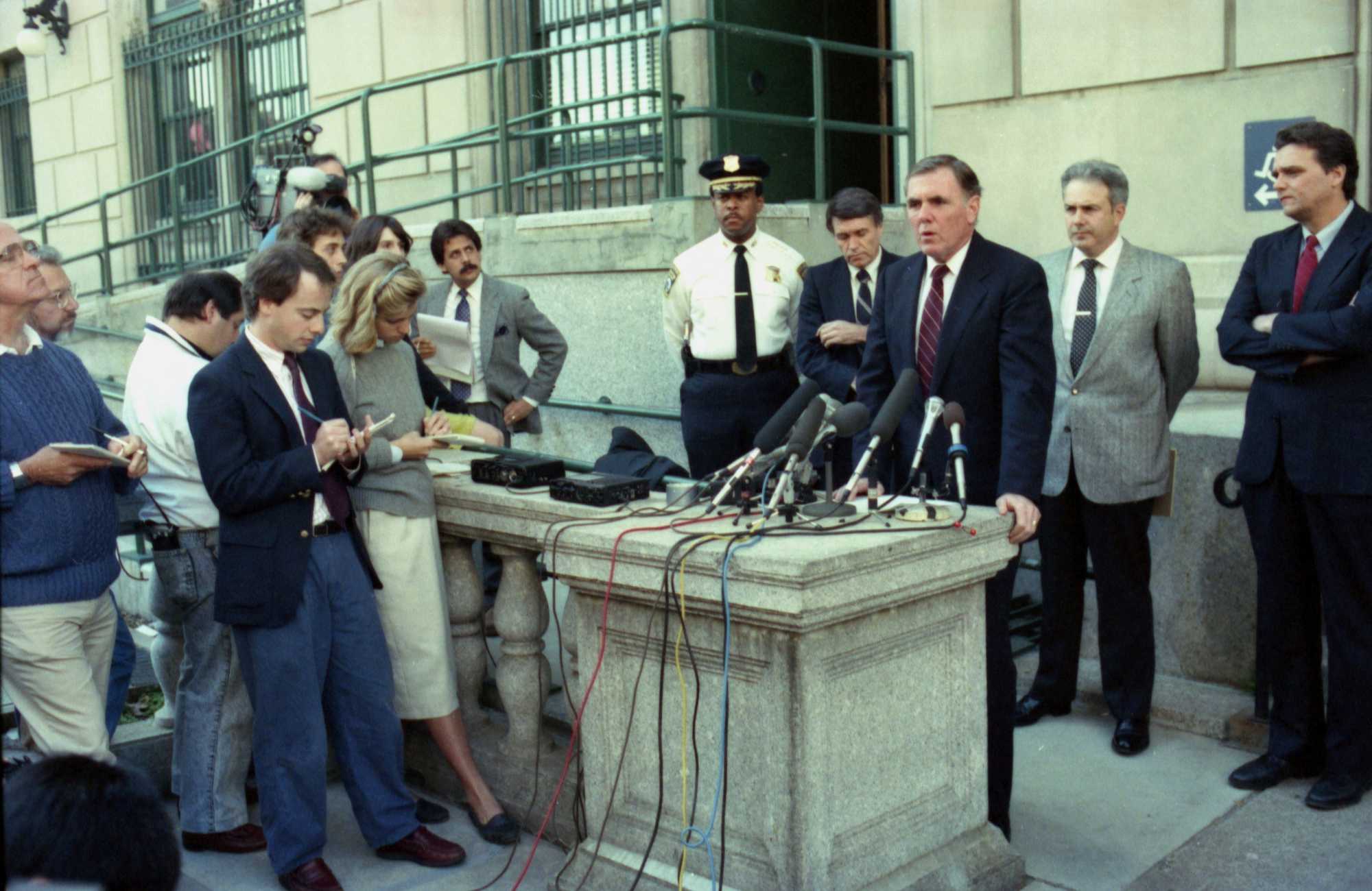 Boston Mayor Ray Flynn, with Boston Police Deputy Superintendent Joseph Carter (far left in uniform) and Police Commissioner Francis "Mickey" Roache (left), spoke with the media about the murder of Carol Stuart on Oct. 24, 1989. 