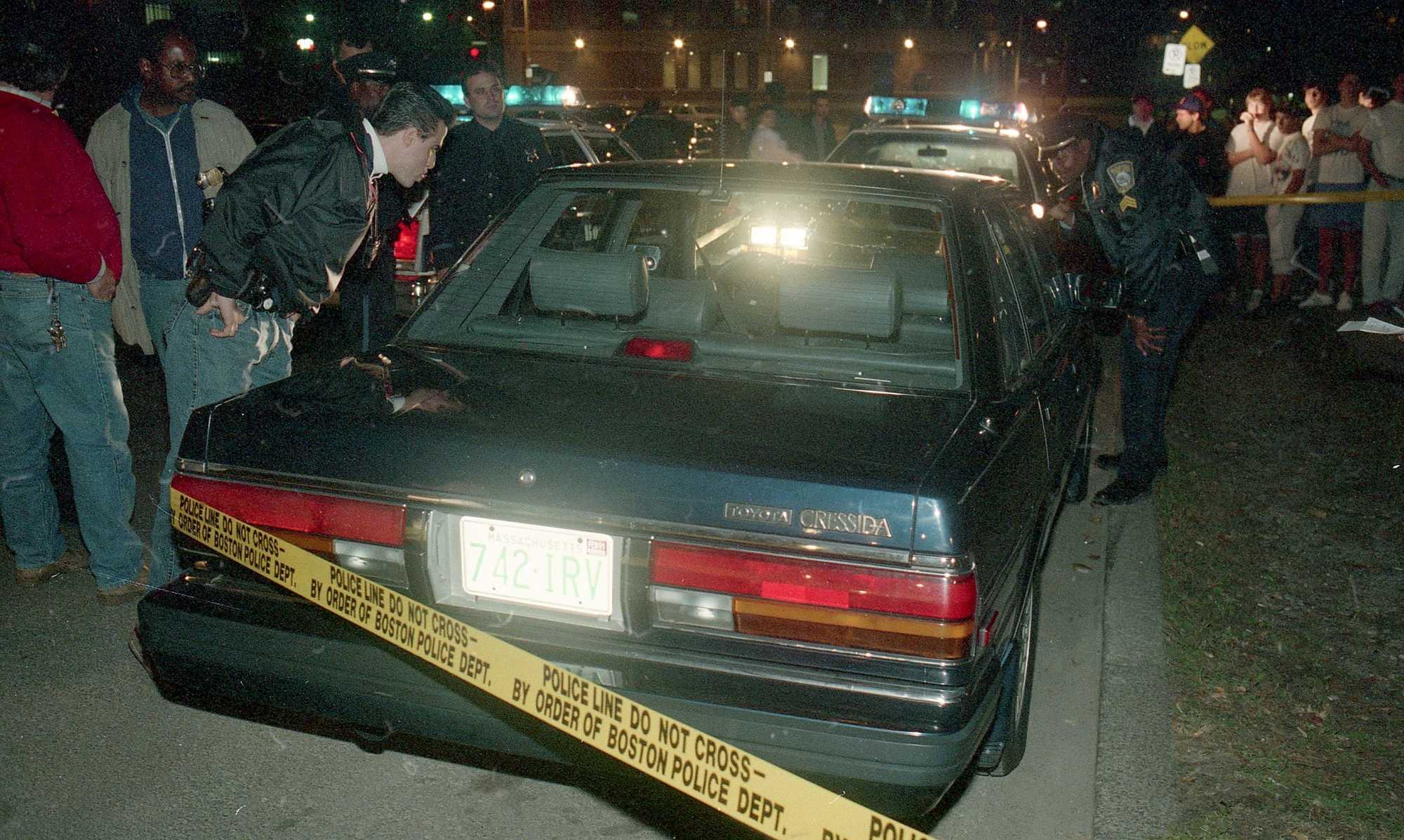 Police examined the Stuarts' car on St. Alphonsus Street in Mission Hill on Oct. 23, 1989.