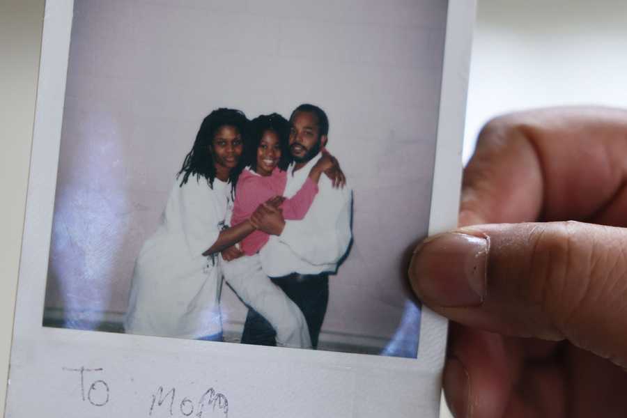 Concord, MA--3/7/2022-- Paul Gunter holds out a Polaroid of a photo taken of him with his wife, Lisa, and daughter Paulihsa before he was arrested. (Jessica Rinaldi/Globe Staff) 
