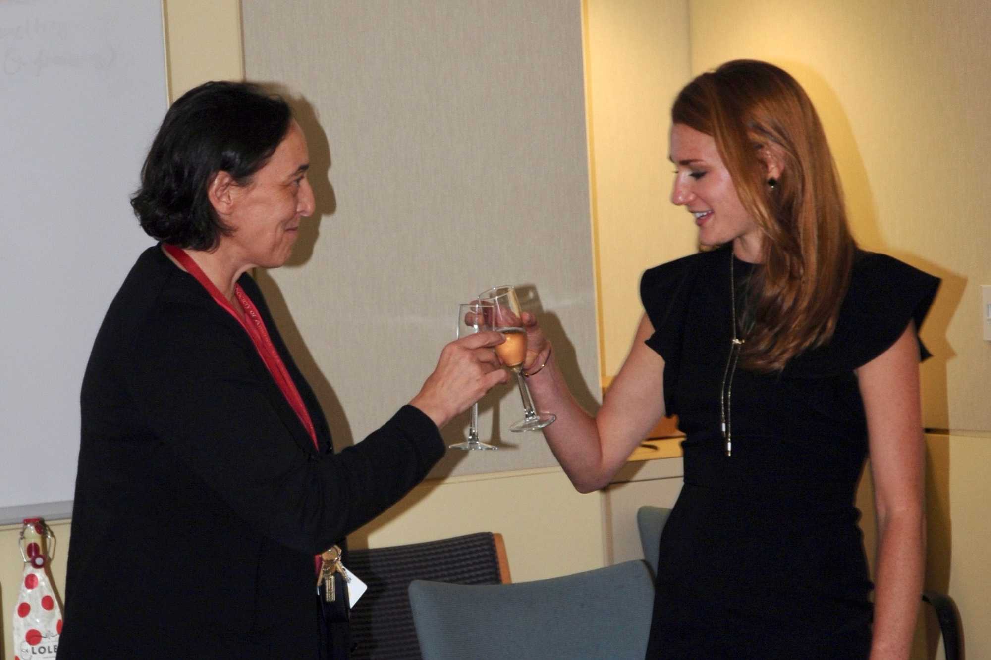 Kristin Knouse (right) and the late Angelika Amon, who was an MIT professor and her mentor, at a celebration in the Amon lab after Knouse defended her PhD thesis on Sept. 9, 2016.