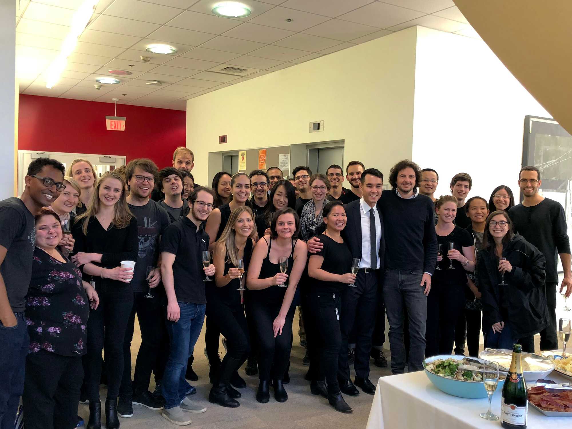 Scientist David Sabatini and his researchers in his lab gathered to celebrate a lab member’s thesis defense in October 2018.