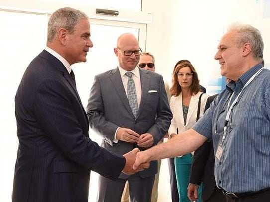 Ralph de la Torre, the founder and former chief executive of Steward Health Care, shook hands with an employee of one of Malta's public hospitals as Armin Ernst, the CEO of Steward Health Care International (center,) looked on in April 2018.