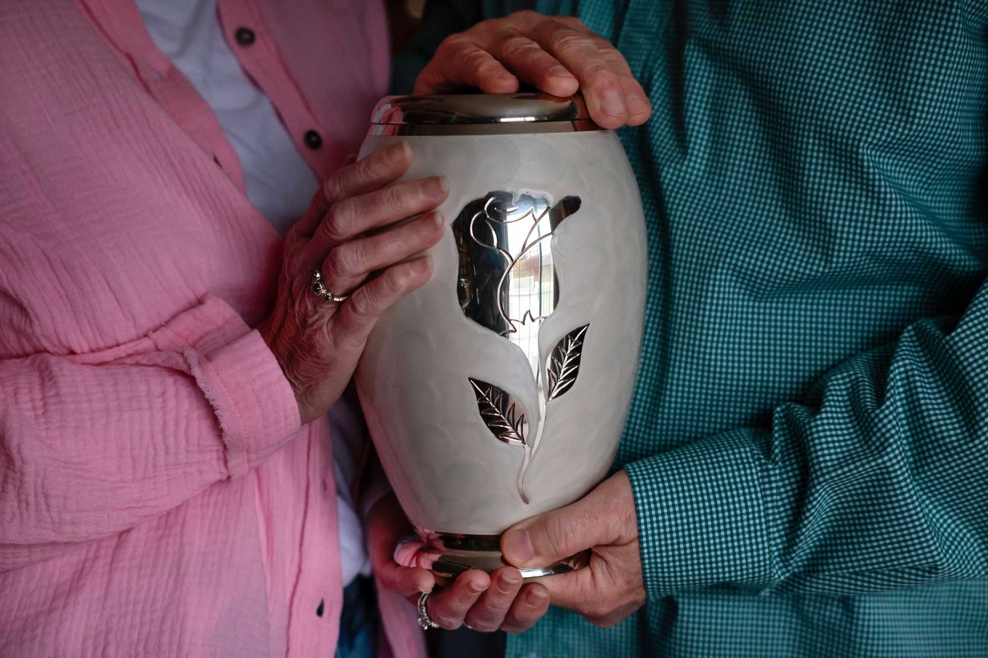 Donna and Joseph Knight held the urn of their daughter, Jennifer, at their home in Middleborough. Many circumstances of her death last year were unknown to them until recently.