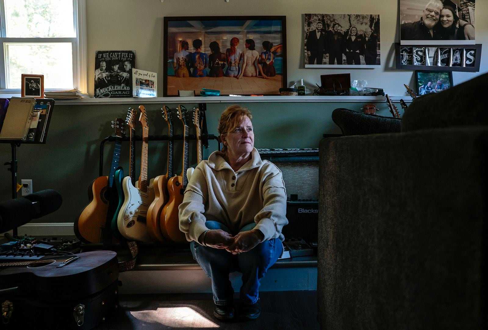 Joan Shea sat with her husband’s guitar collection at her home in West Bridgewater. Michael Shea, 66, died at Good Samaritan Medical Center in Brockton.