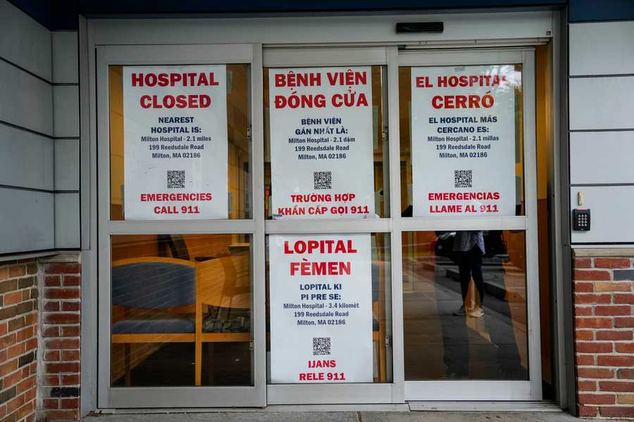 “Hospital Closed” signs are put up and chairs barricade the emergency department doors after the final closing on the last day at the emergency department at Carney Hospital in Dorchester.