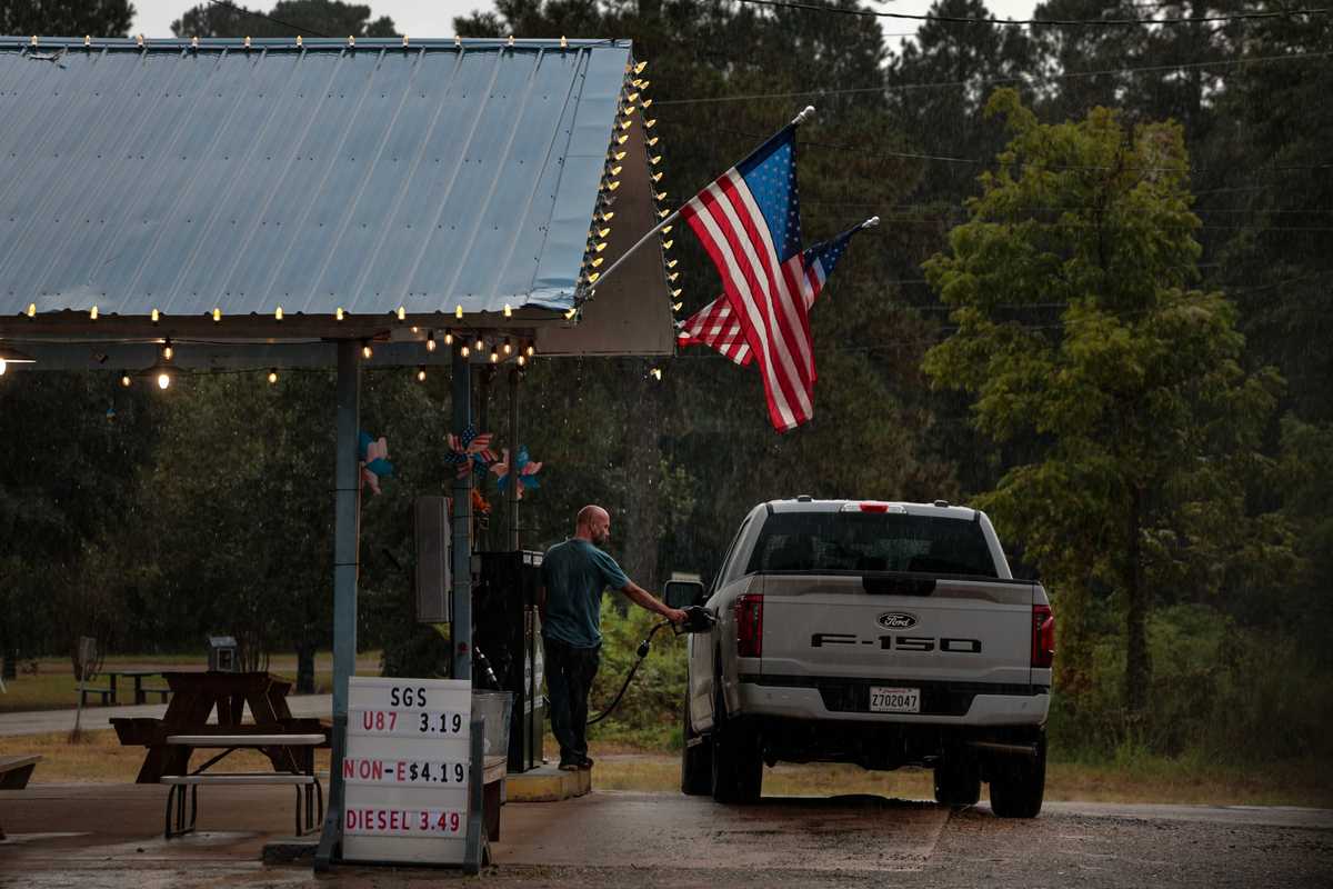 Mark Risinger fills his gas tank outside the Spearville General Store in Spearsville, LA.