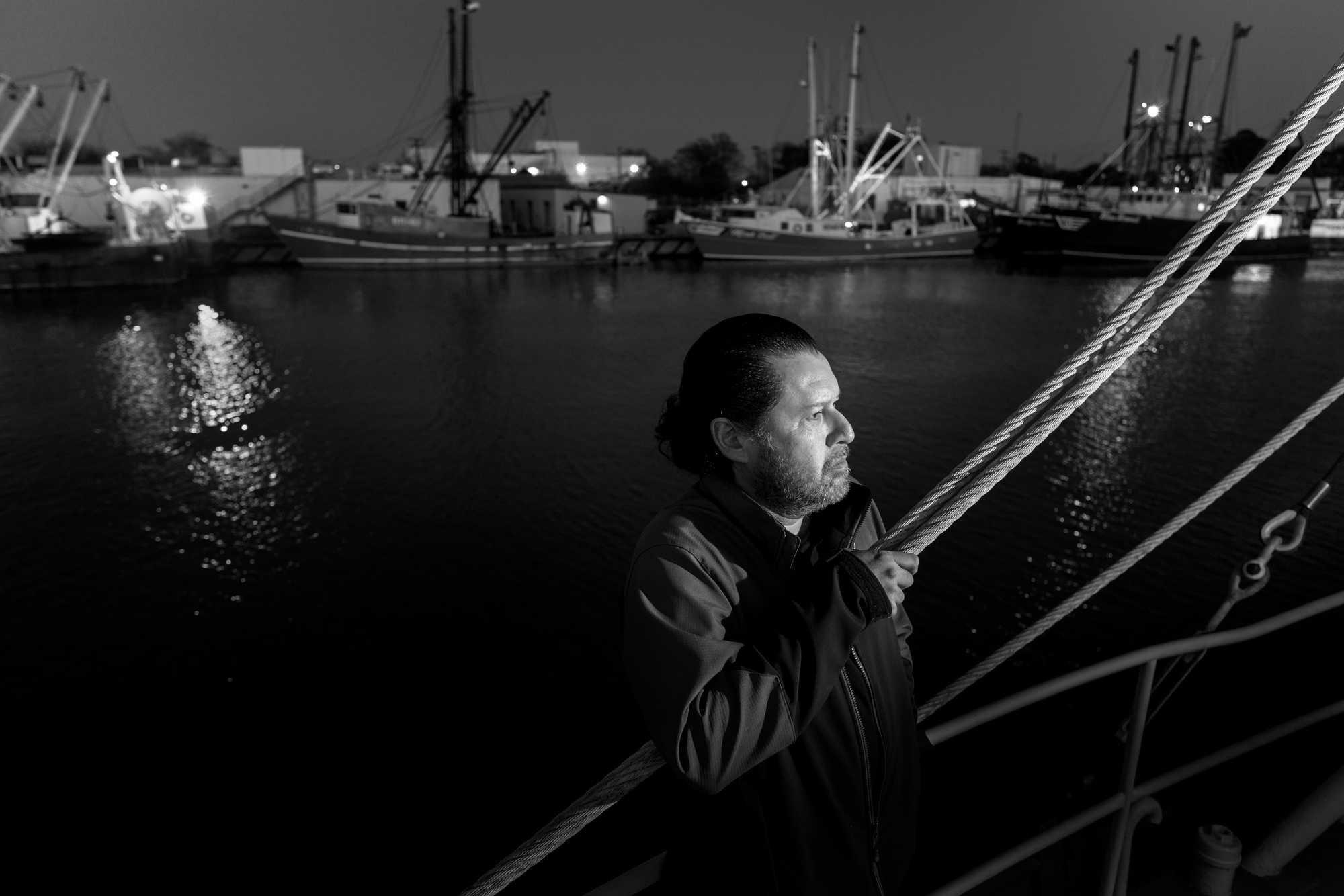 Captain Freddy Loya stood on a scallop boat docked in the Small Boat Harbor in Newport News, Va. Loya was captain of the Little Tootie, another scalloper, when a New Bedford police Officer Jorge Santos boarded it, threatened the crew, and searched for drugs.  