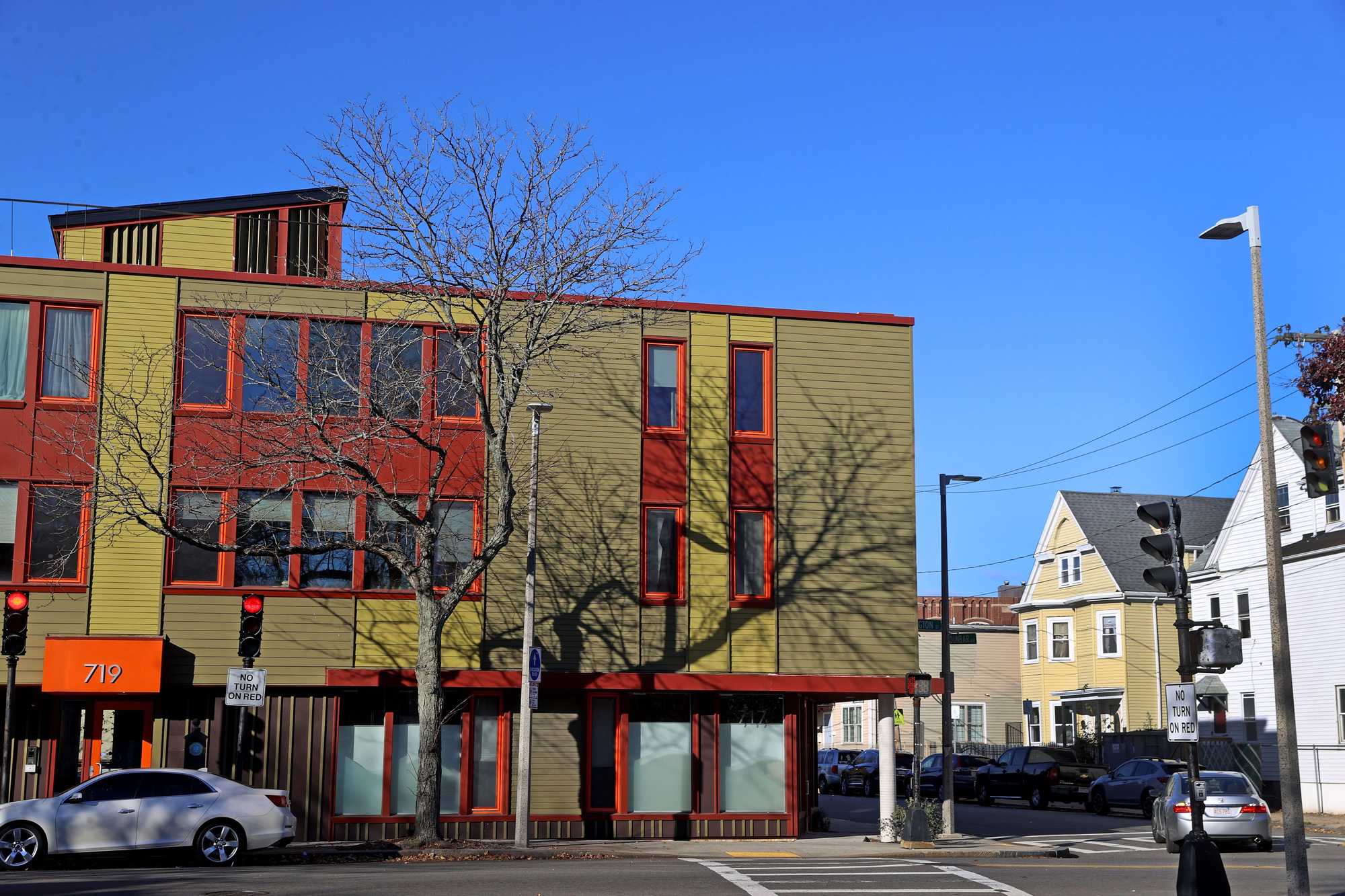Thomas Duplessy points to these condos on Washington Street in Dorchester — eight three-bedroom units that sold for nearly $4 million combined between 2018 and 2020 — as examples of why he should hold onto his home on Dunbar Avenue.