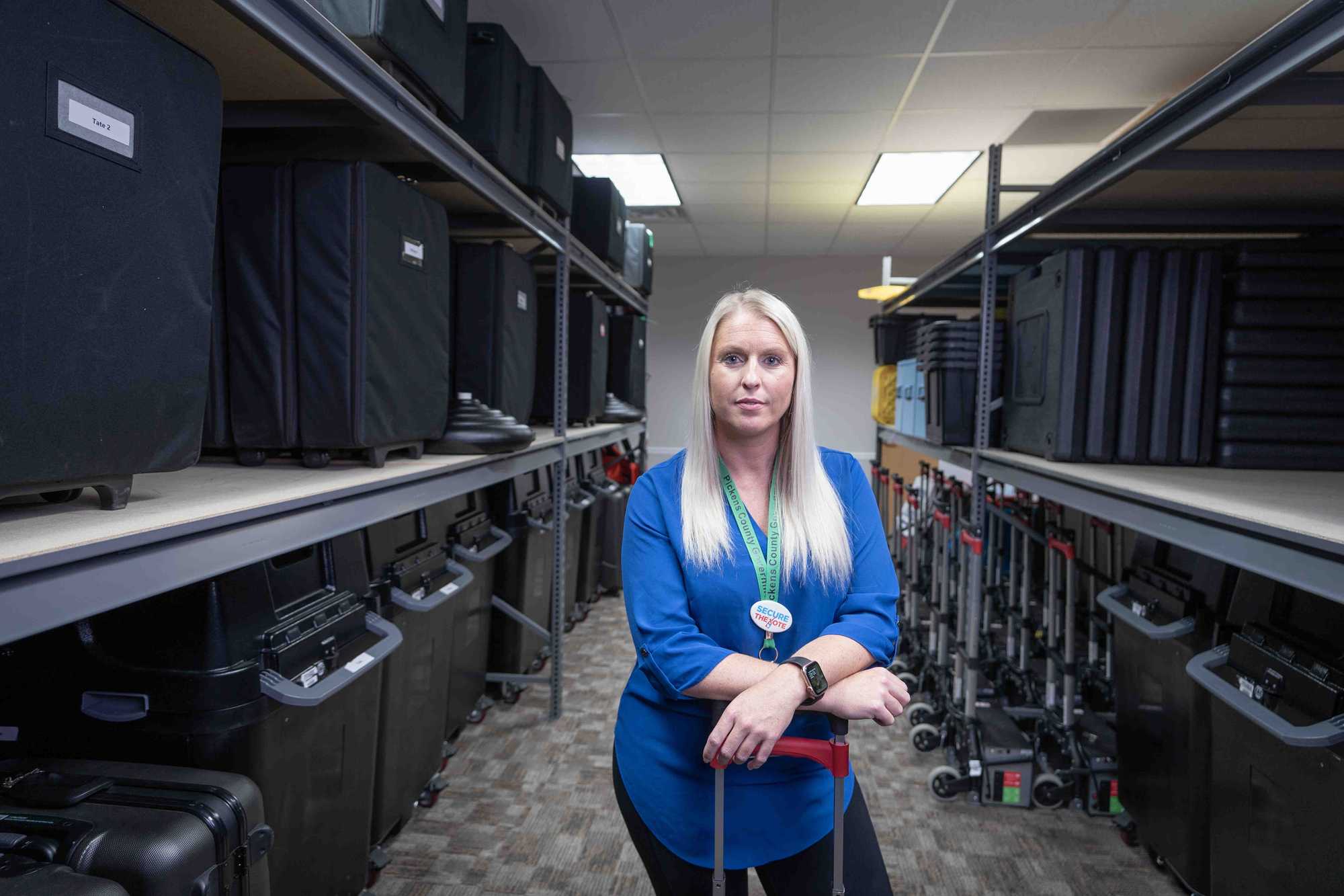 Stacey Godfrey, supervisor of the Pickens County Board of Elections and Registration, in the storage room containing ballot-marking devices, printers, and scanners in Jasper, Ga. 