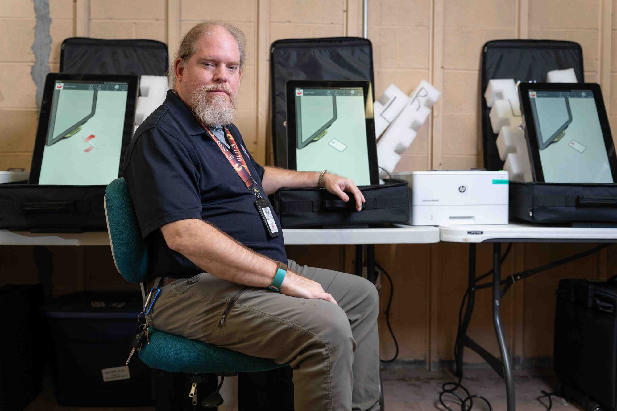 Thomas Gillon, the interim elections supervisor in Macon-Bibb County, sat inside a tech room where ballot marking machines were being tested in Macon, Ga. 