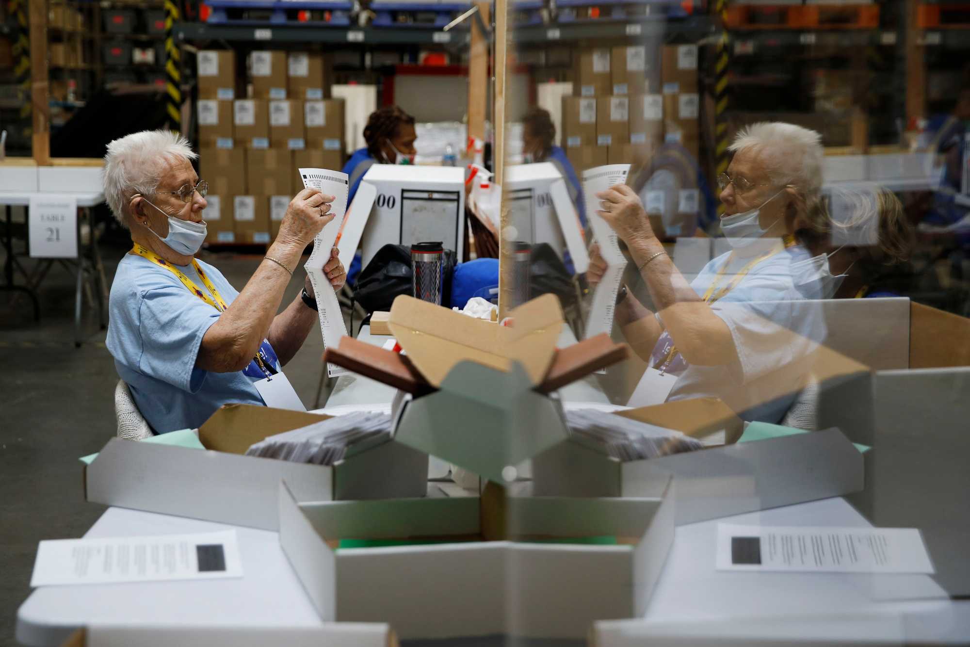 Election workers processed mail-in ballots during a nearly all-mail primary election in Las Vegas on June 9, 2020. 