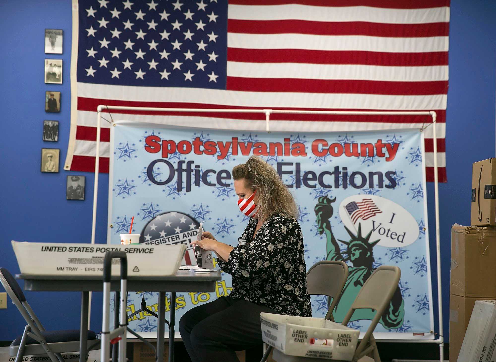 Kellie Acors, county registrar, processed absentee ballots at the Spotsylvania County Office of Elections in Virginia on Nov. 4, 2020. 