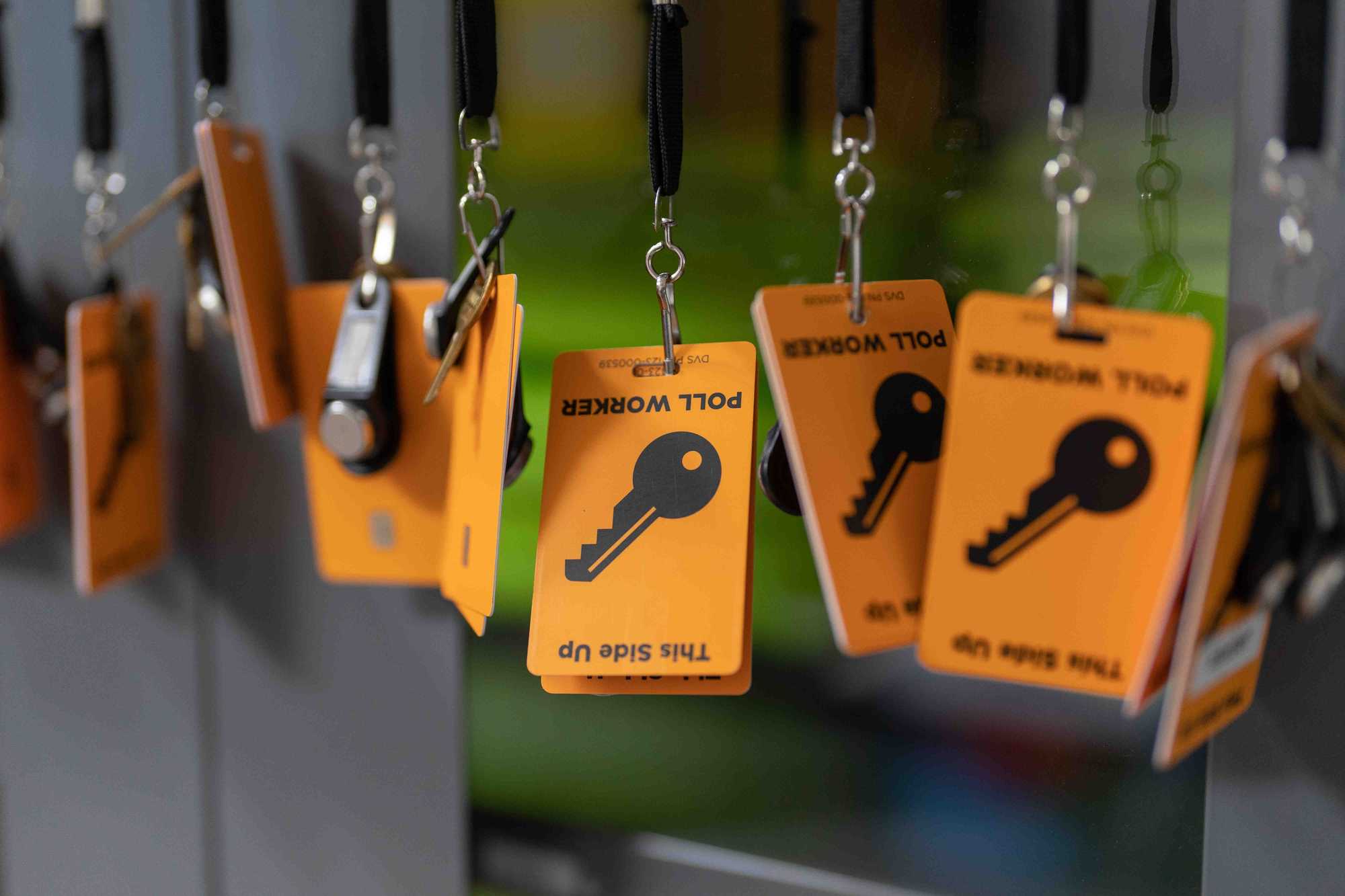 Poll worker badges hung in the storage room containing ballot marking devices, printers, and scanners in Jasper, Ga. 