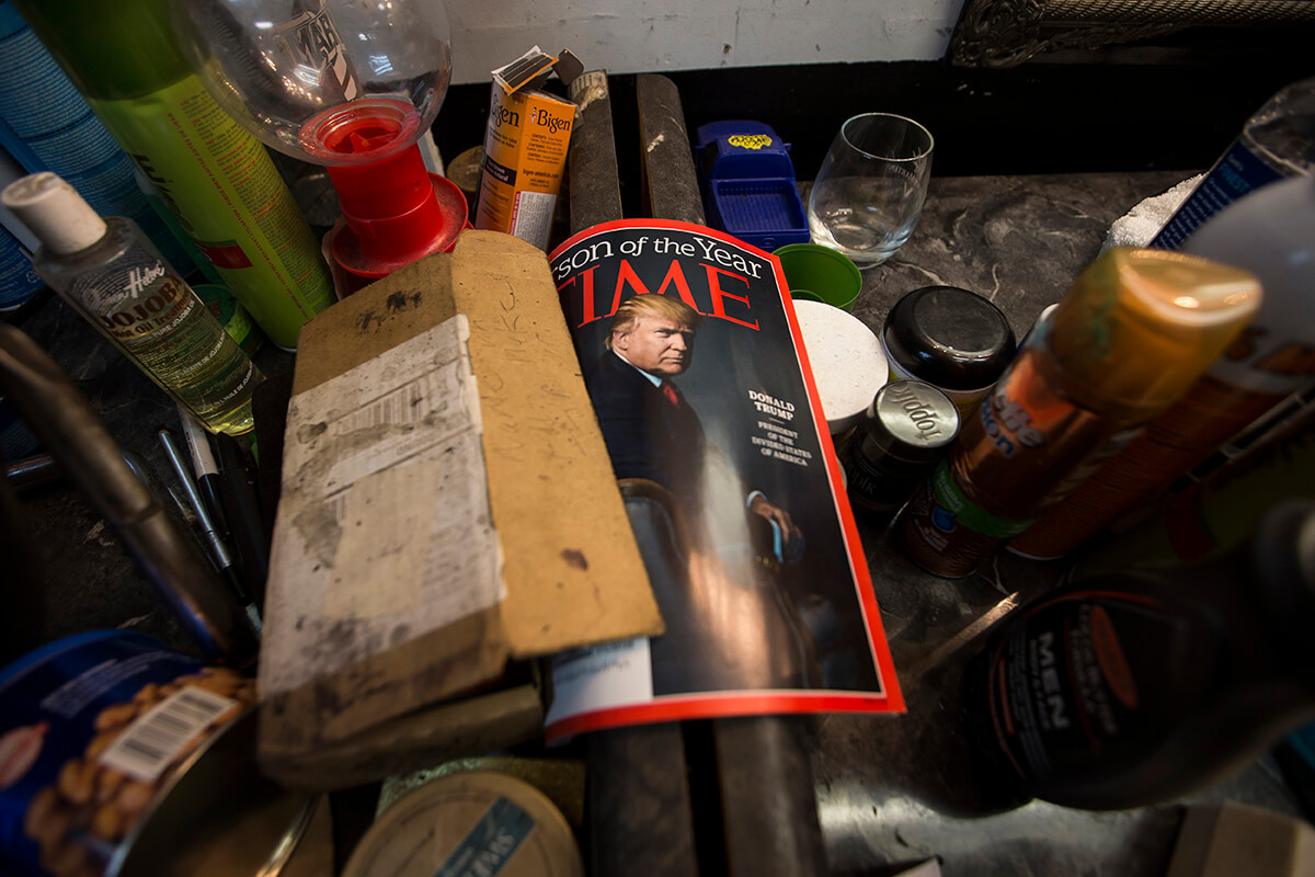 A Time magazine with President-elect Donald Trump on the cover sits in a work station at the Prime Time Barber Shop in Ferguson, Mo.