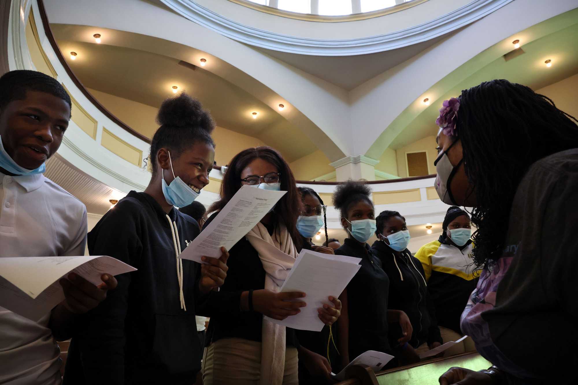 From left: Students Diangelo Acoff, Taylor Davis, and Ayiraa Fortier got direction from Ainka Sanders Jackson (right), the founding executive director of the Selma Center for Nonviolence, Truth and Reconciliation, during a workshop at the Tabernacle Baptist Church.