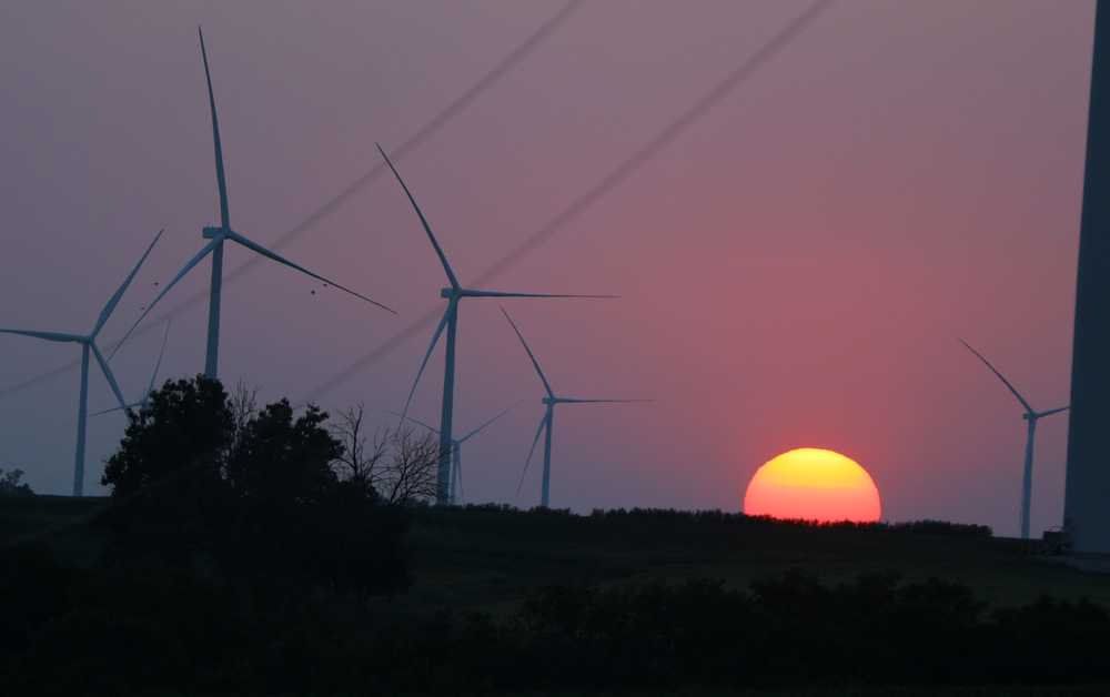 Windmills, dotted around Deep River, Iowa, are viewed at sunset on a September day.