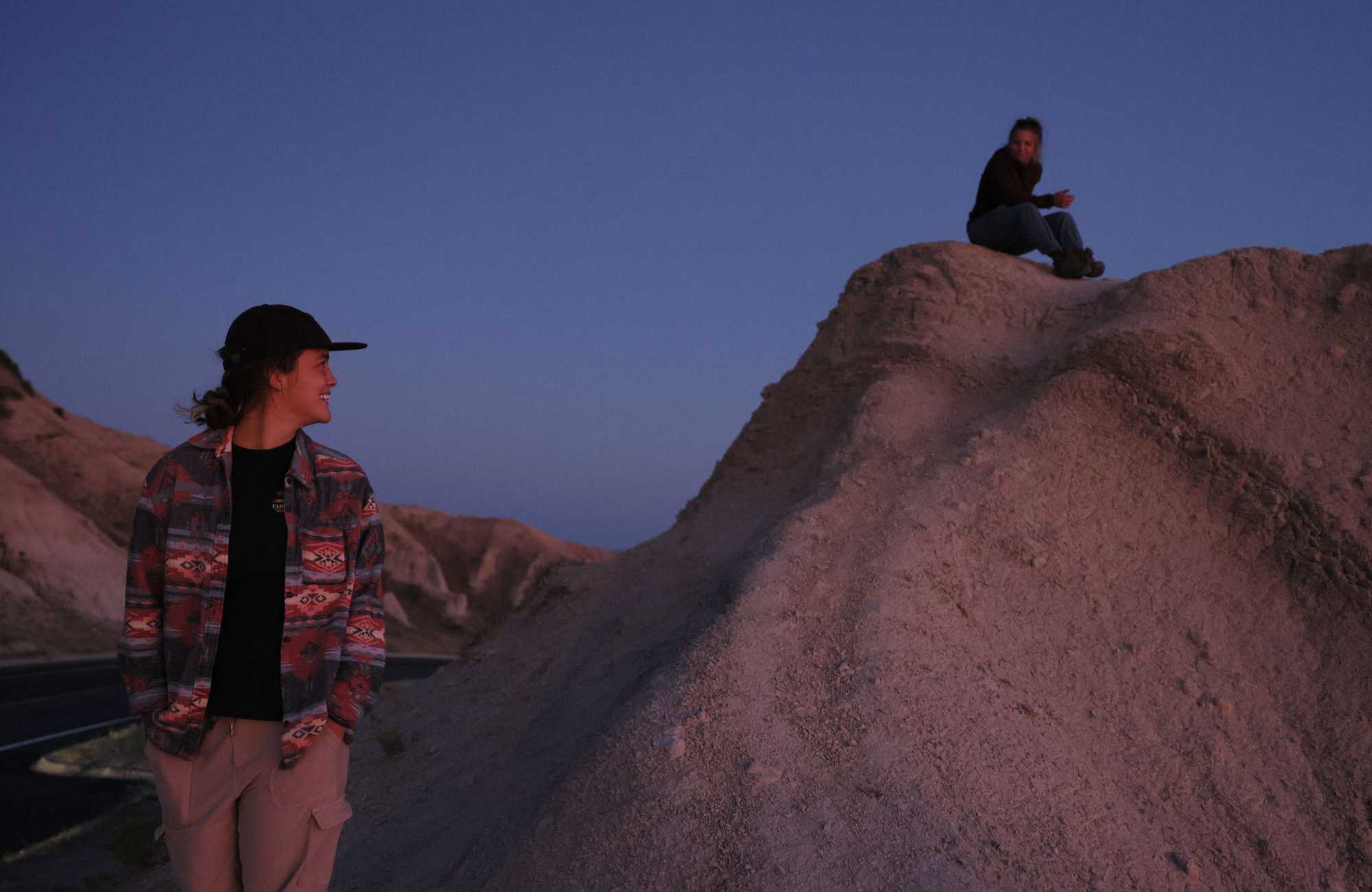 Maine residents Cailyn Forrester and Lacey McKay took in the sunset at Badlands National Park.