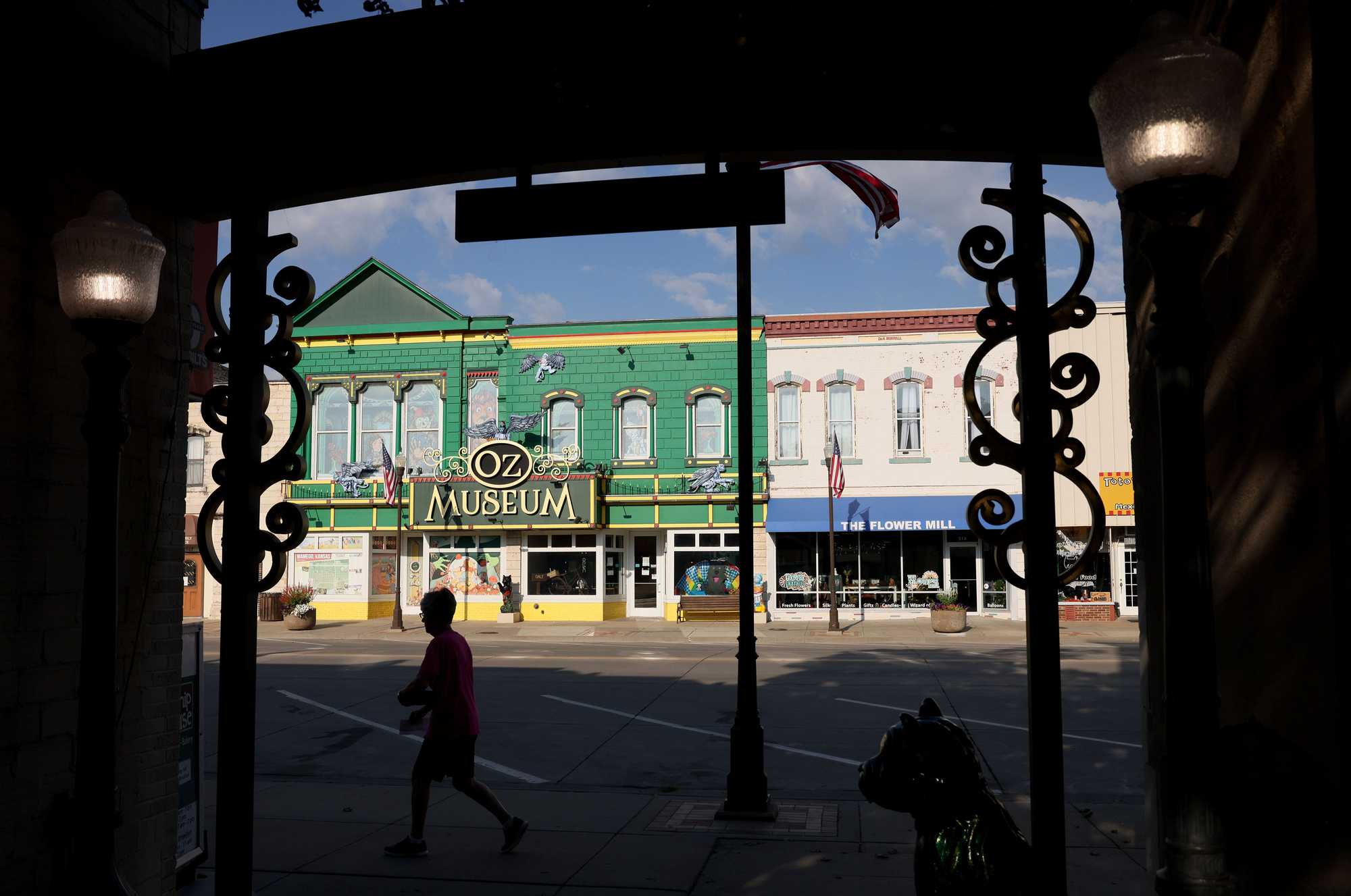 On a September day, a woman walked past the gates of the Yellow Brick Road across the street from the OZ Museum. 