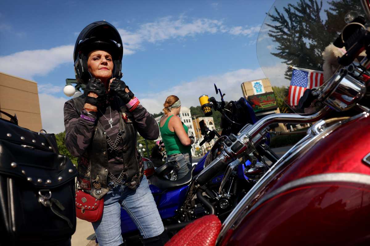 Shelia Hadlow, also known as “Mama Rabbit,” of the Outcasts Motorcycle Club, prepared to depart Hot Springs, Ark., on Sept. 11. Members of her club, from Moonshine Hill, Texas, were in town for the Ladies in Leather motorcycle rally. Of her nickname she said, “I’m just everybody’s mama. It doesn’t mean I’m the oldest.” 