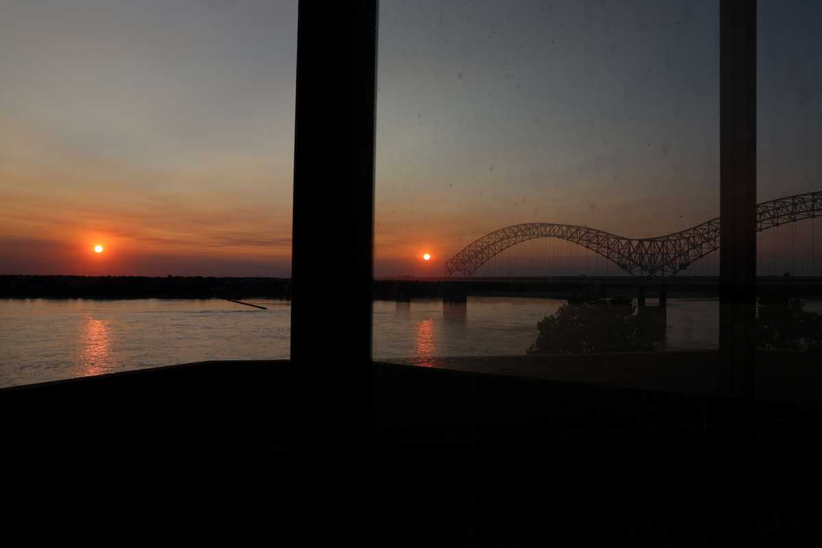 The sunset was reflected in a window on the Mississippi Riverwalk on Mud Island in Memphis.