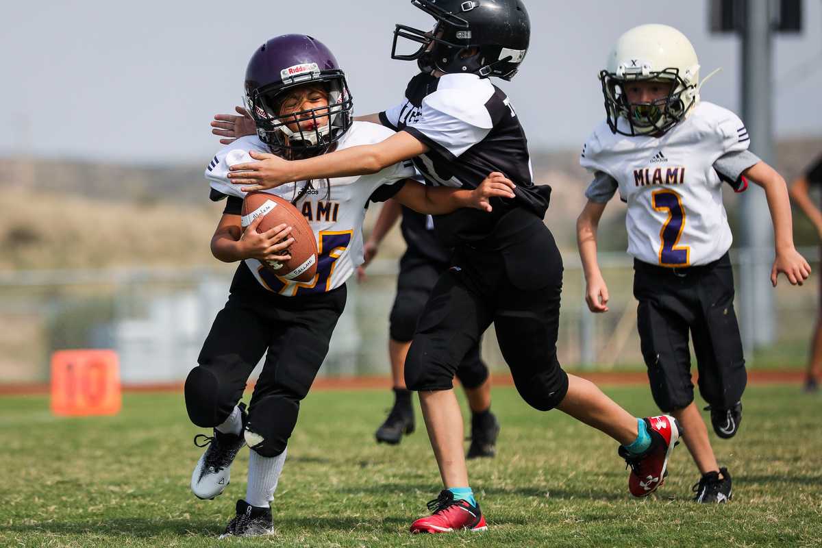 The 8-year-old attempted to fend off a tackle.