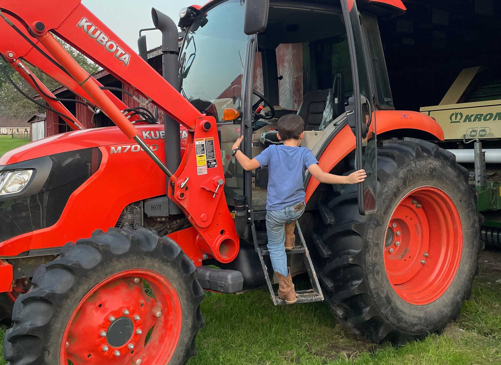 Isiah Thompson climbed into one of his family’s tractors, on their farm in Green Bank, W.Va. 