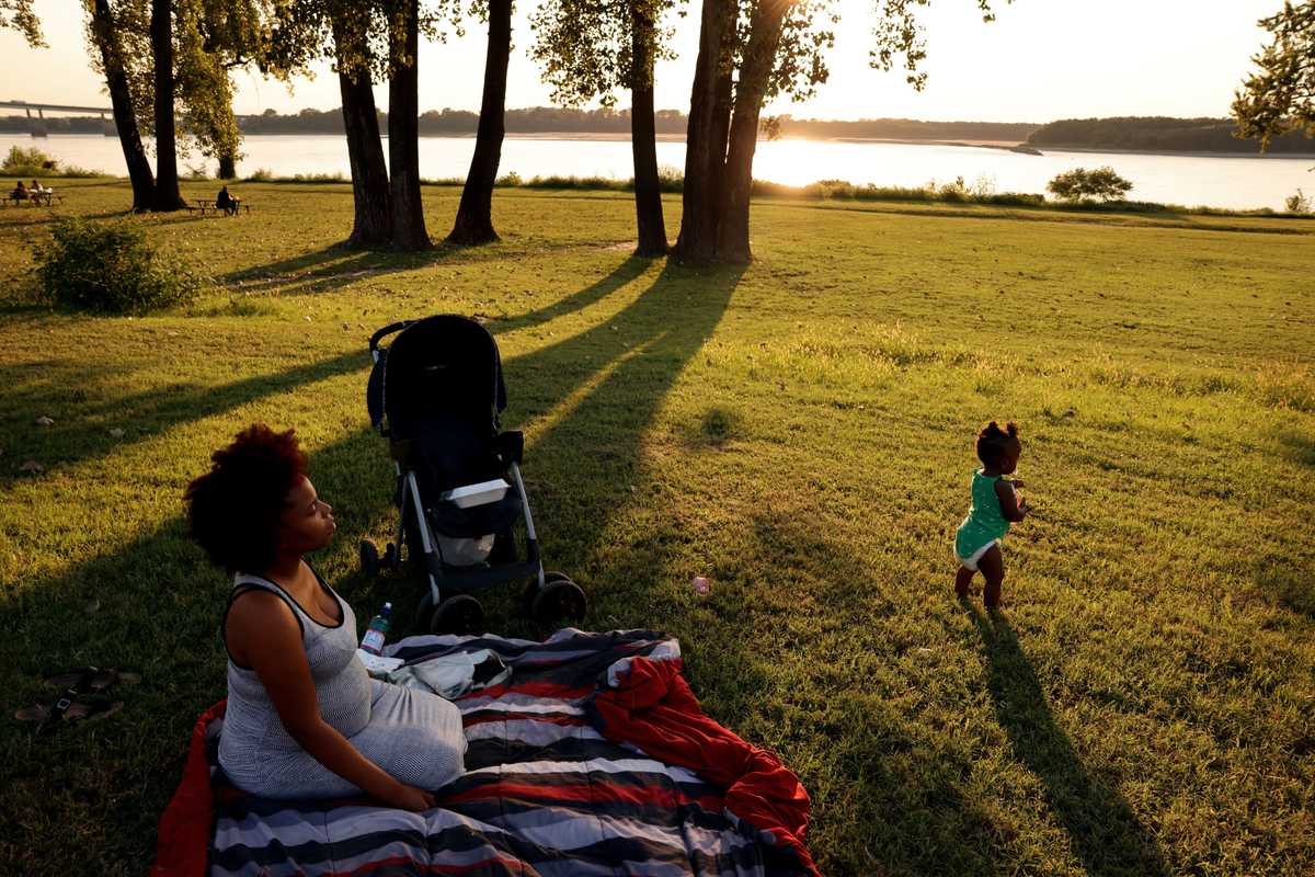 Ranisha Cannon of Memphis sat with her daughter, Kasey, along the Mississippi River on a September day.