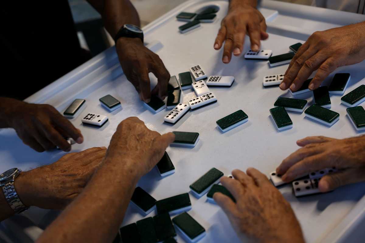 Cuban native Luis Barrero (lower right) played dominos at Domino Park in the Little Havana neighborhood.